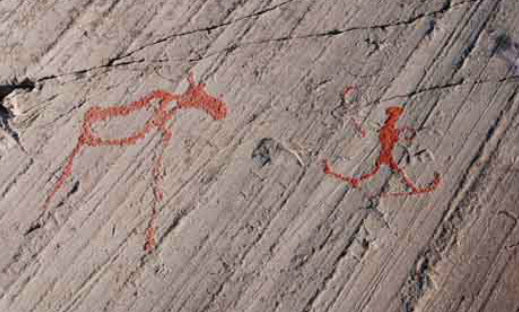 skiers rock cave paintings